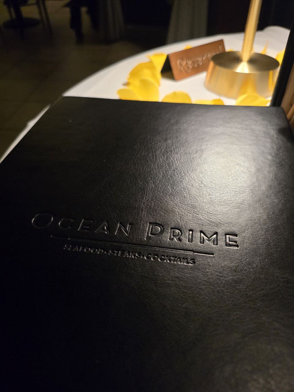 Ocean Prime embossed leather menu cover close-up