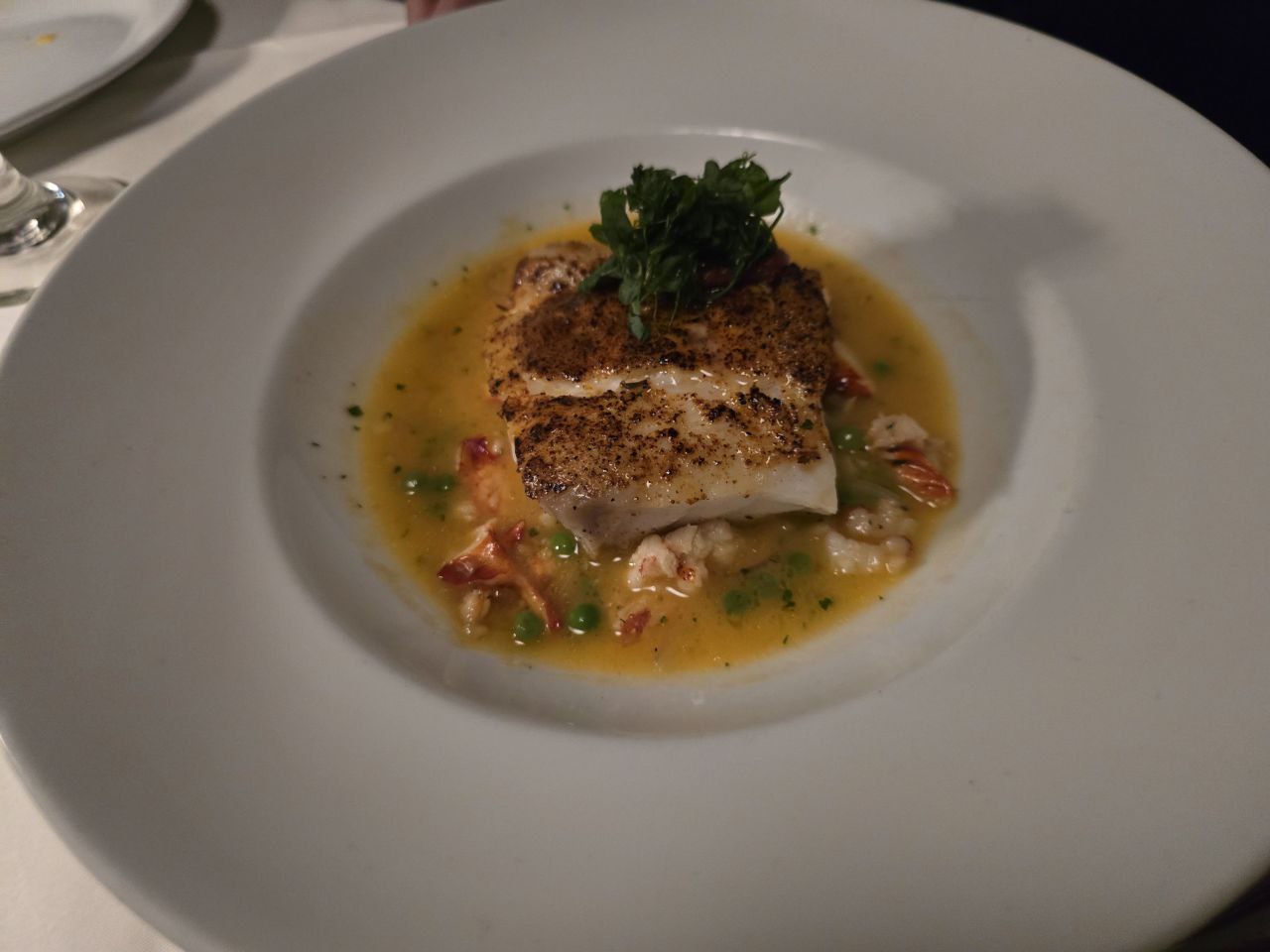 Grouper with lobster gnocchi spring peas and lemon jus at Ocean Prime Orlando