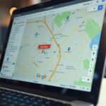 A close-up of a laptop screen showing a Google Maps interface with a business listing marked as unav